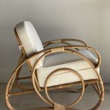 Large rattan rest chair and white cushions