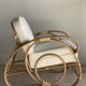 Large rattan rest chair and white cushions
