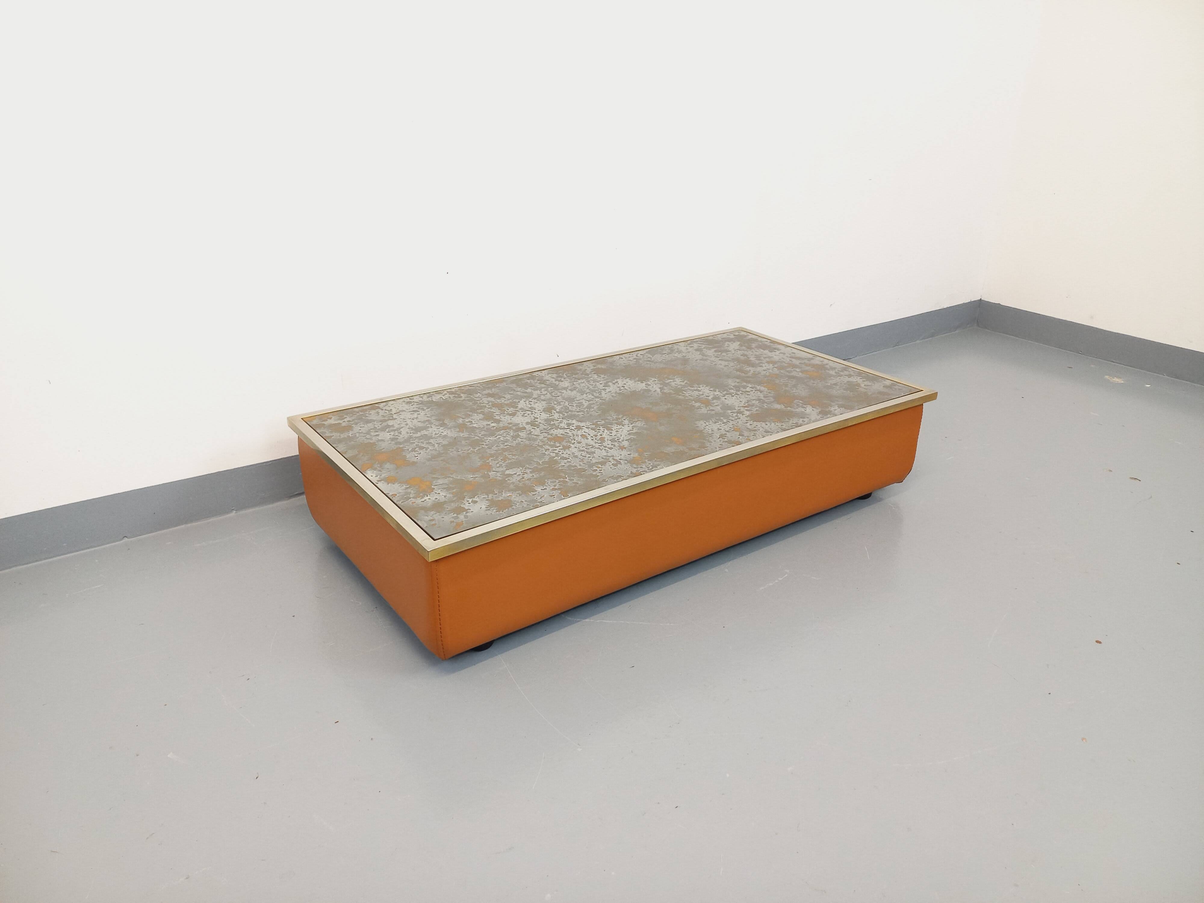 Vintage coffee table in églomisé glass, chrome and leather from the 70s