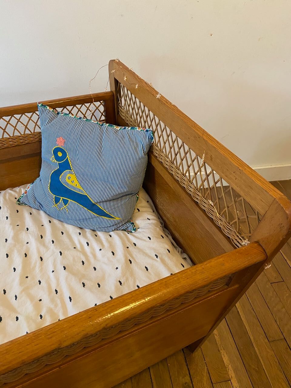 Wooden and wicker baby bed