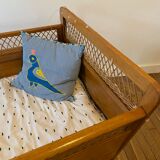 Wooden and wicker baby bed