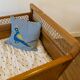 Wooden and wicker baby bed