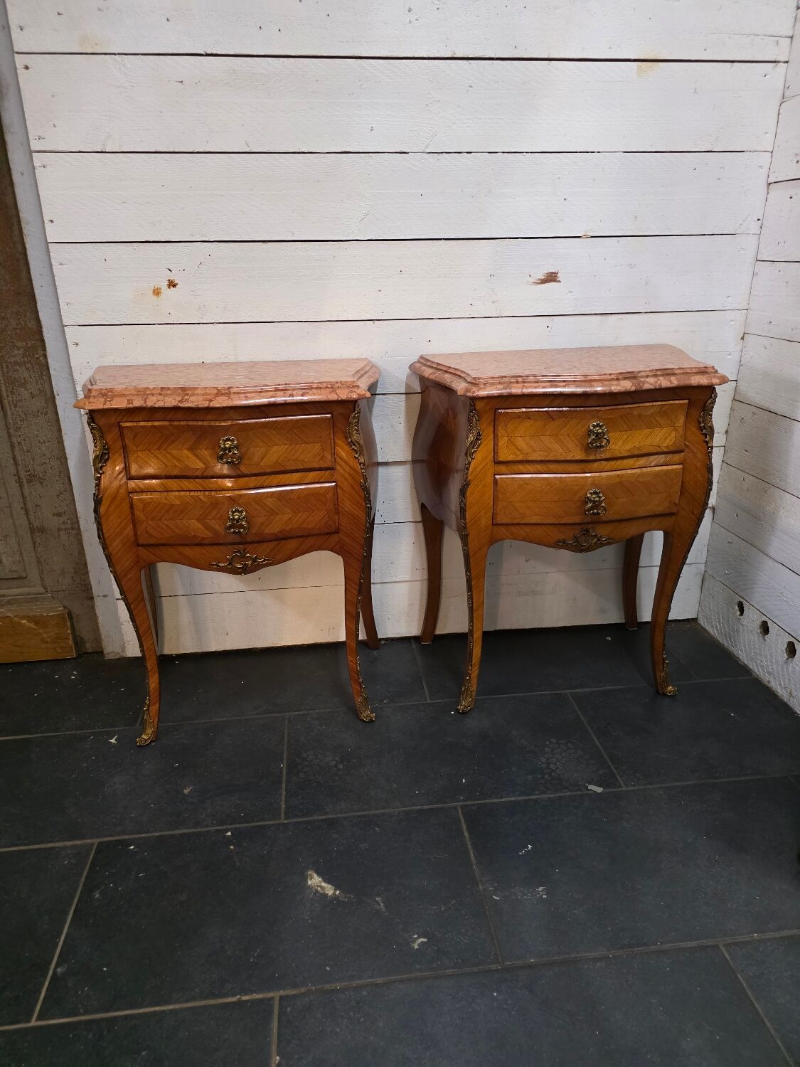 Pair of Louis XV style curved bedside tables in marquetry