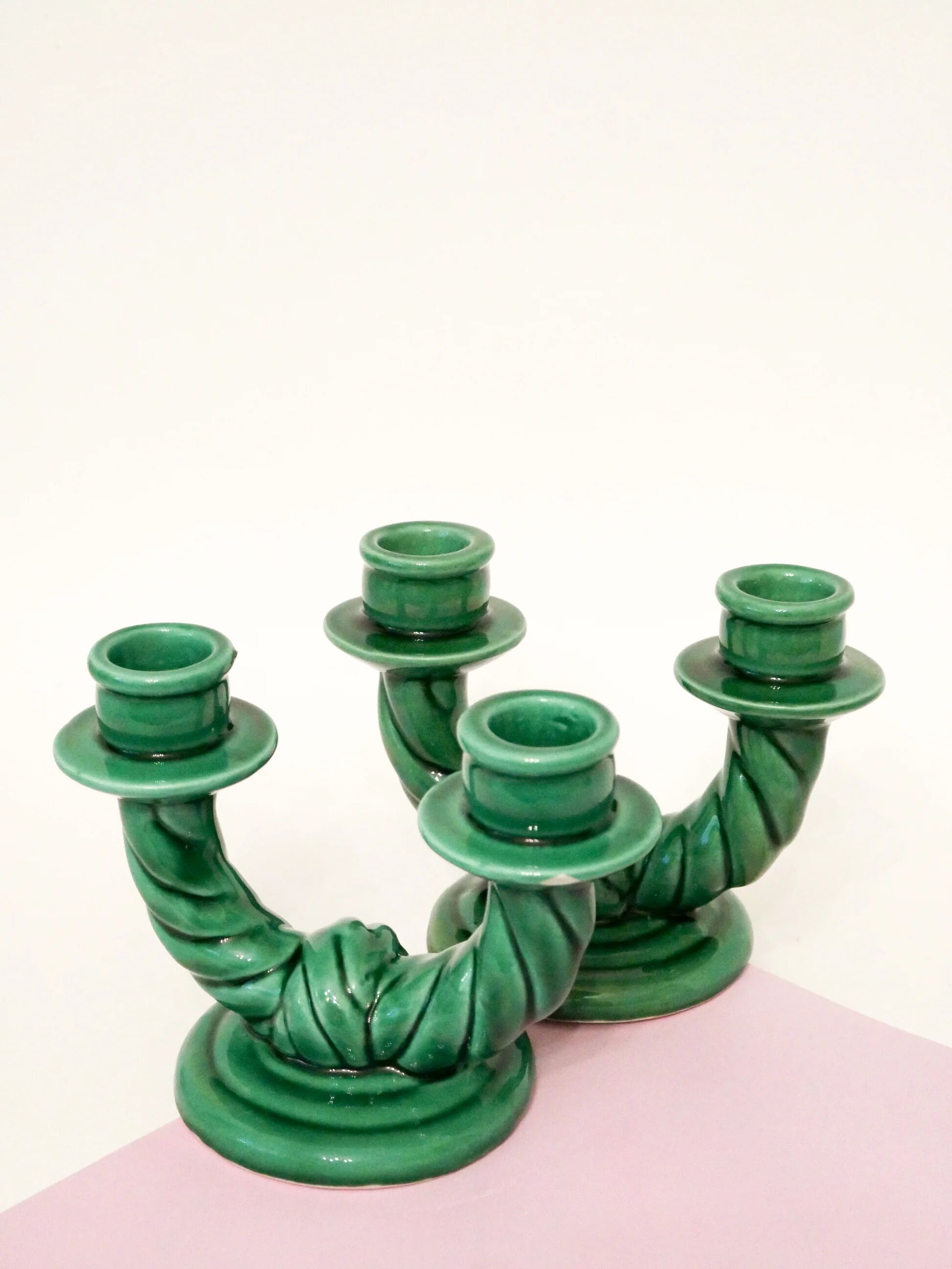 Pair of twisted green ceramic double candlesticks, 1960.
