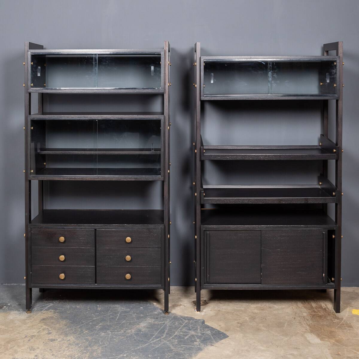 Striking 20thc italian ebonised etageres with open back & storage c.1970