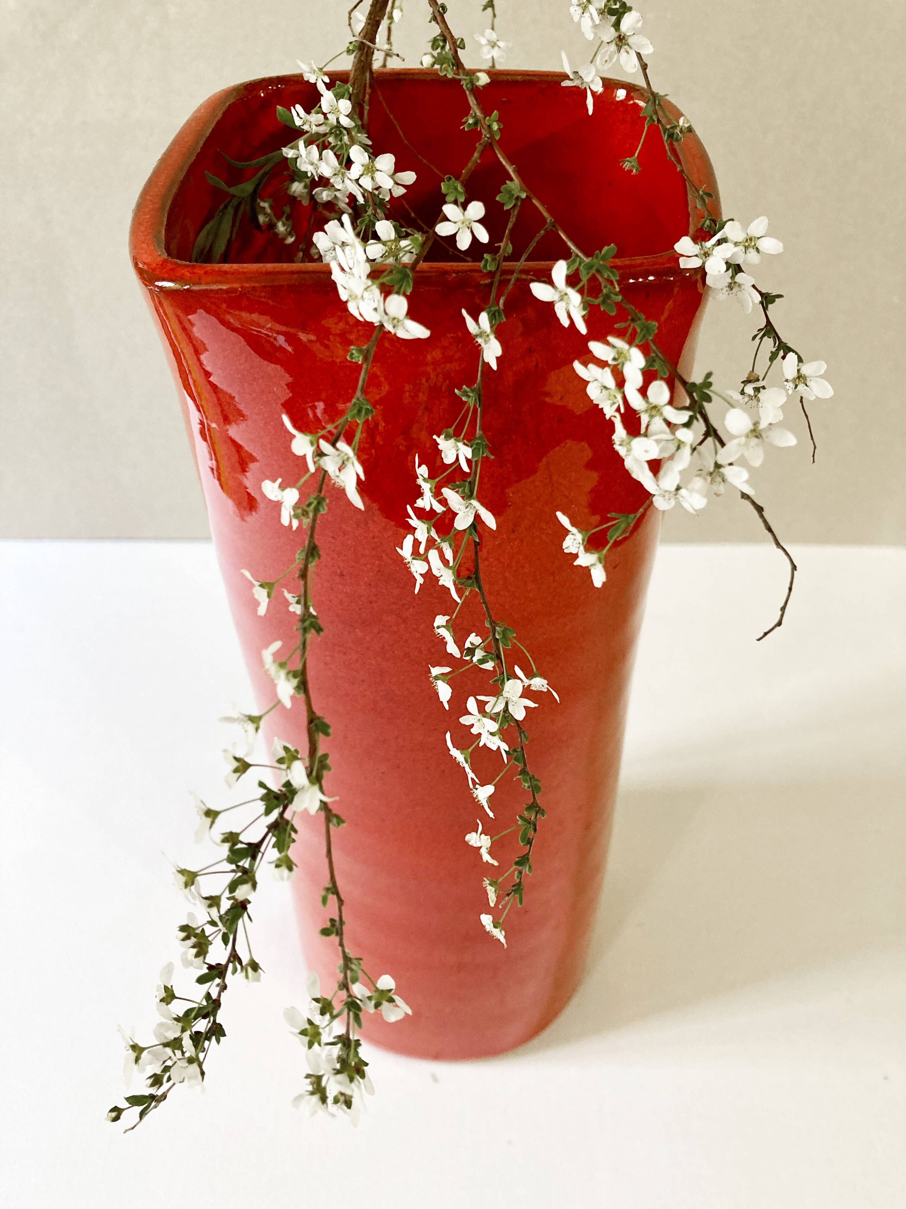 Large red glazed ceramic vase