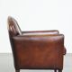 A vintage-style armchair with character, upholstered in beautifully patinated sheepskin.