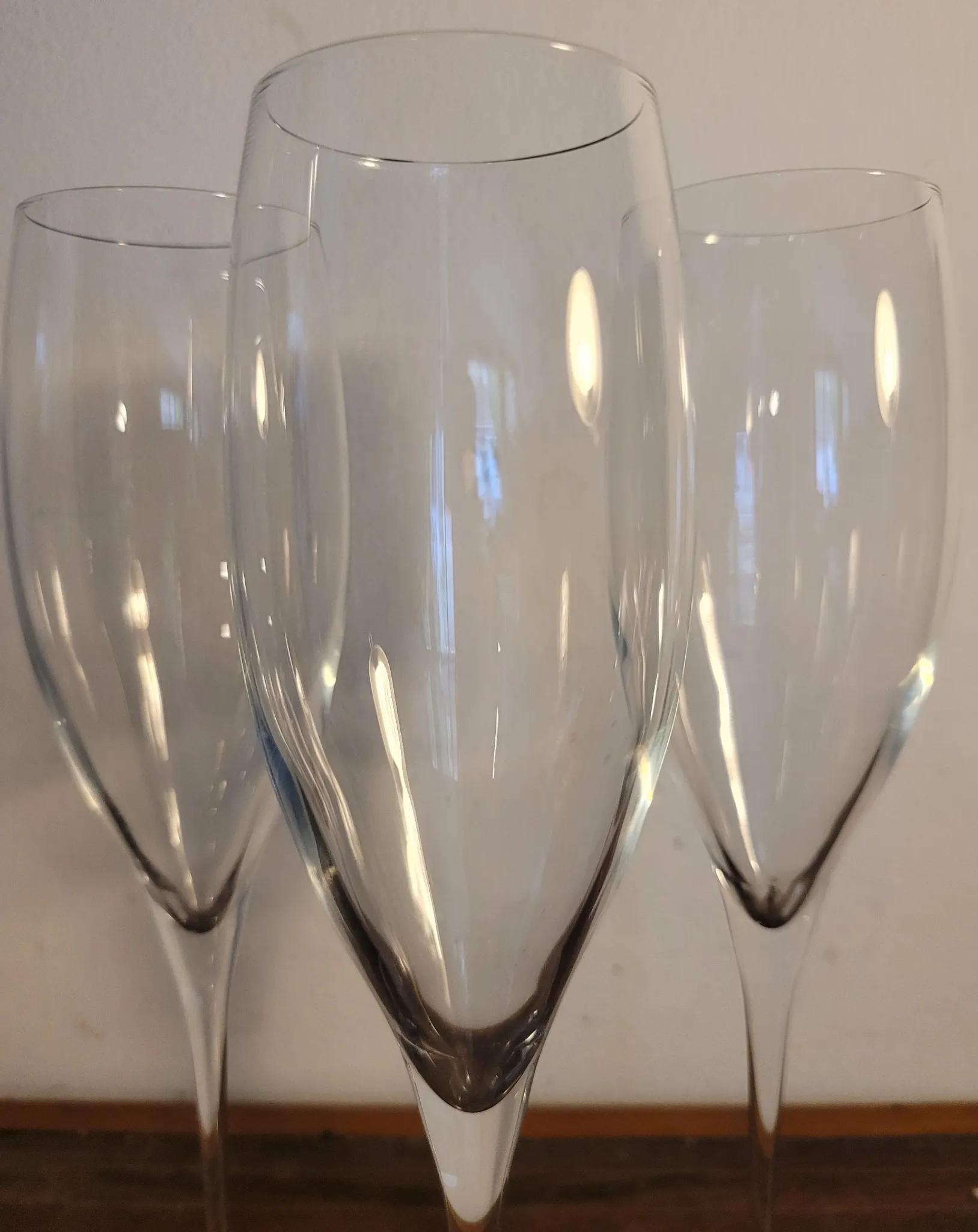 3 large crystal champagne flutes. No brand.