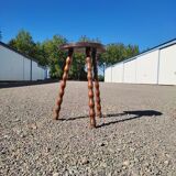 Pretty wooden stool with half moon seat and turned wooden tripod base