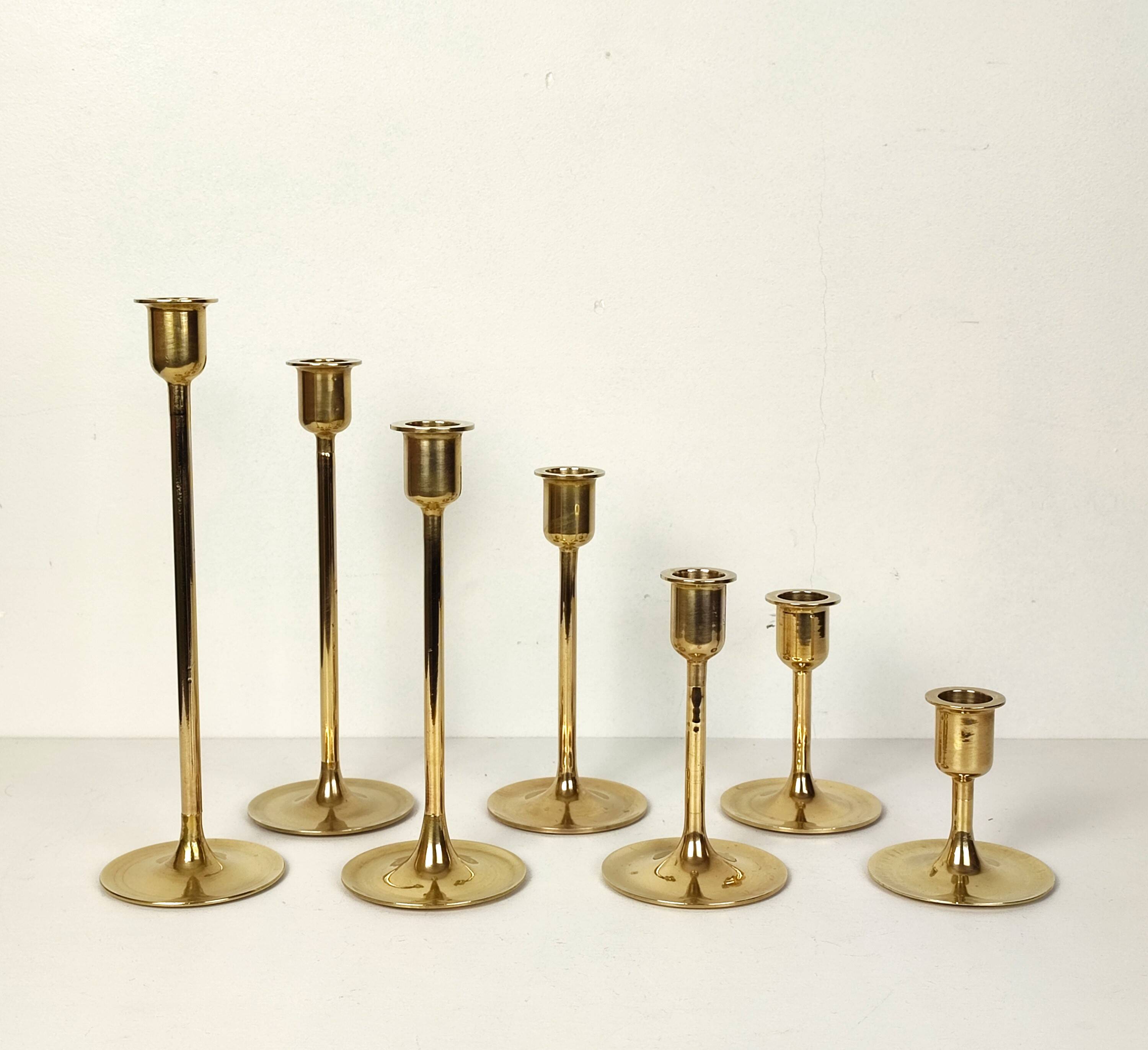 Set of 7 brass candlesticks