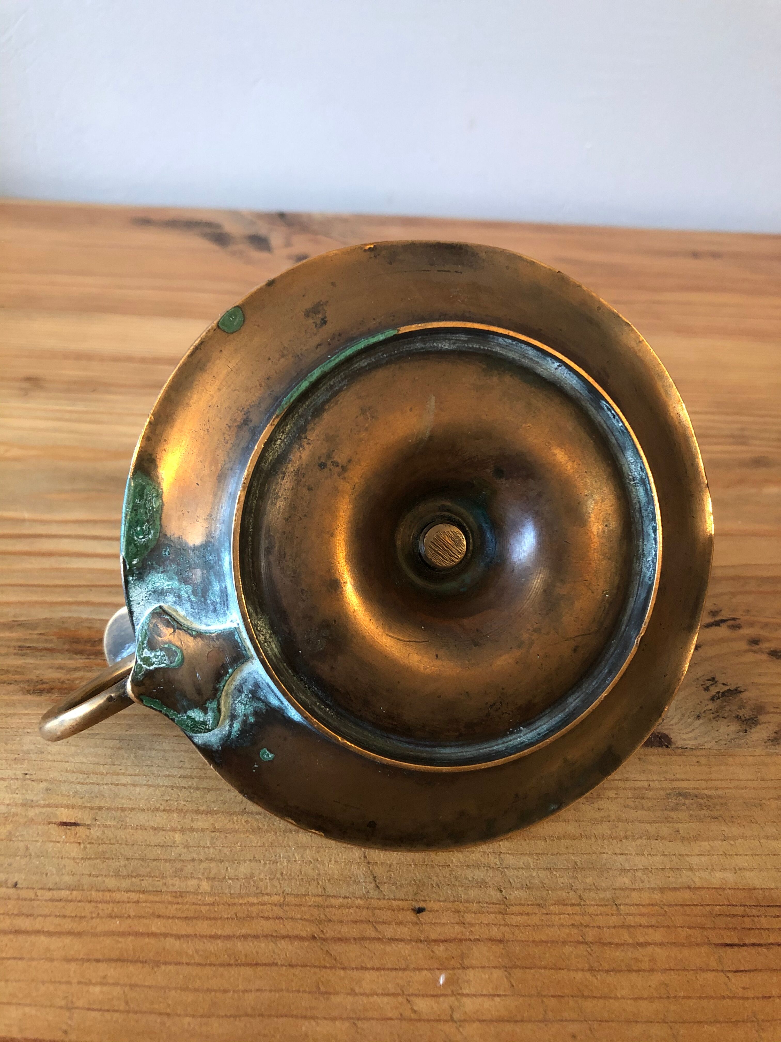 Old copper hand-held candlestick