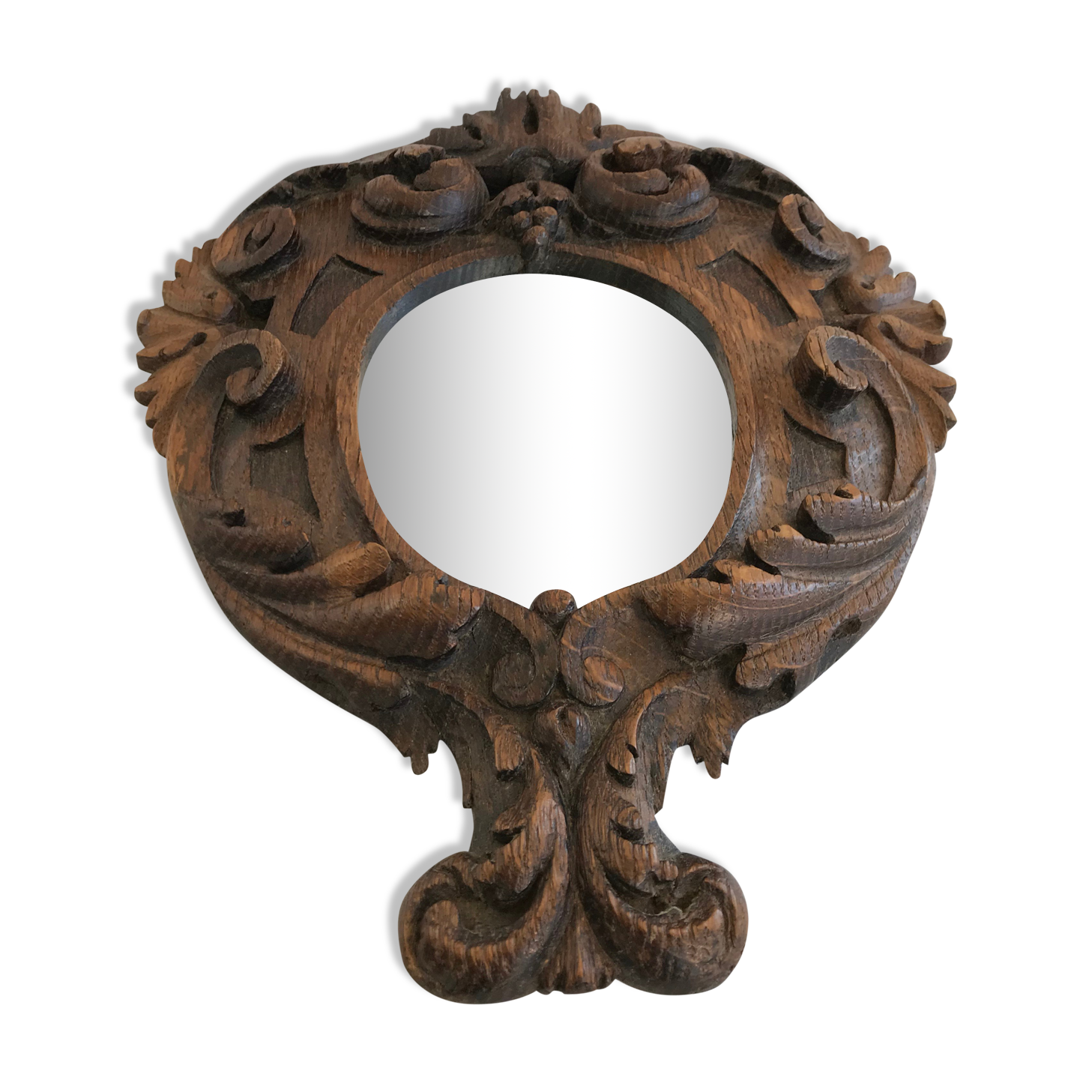 Ancient mirror in carved wood, vintage decoration