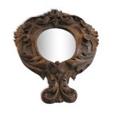 Ancient mirror in carved wood, vintage decoration