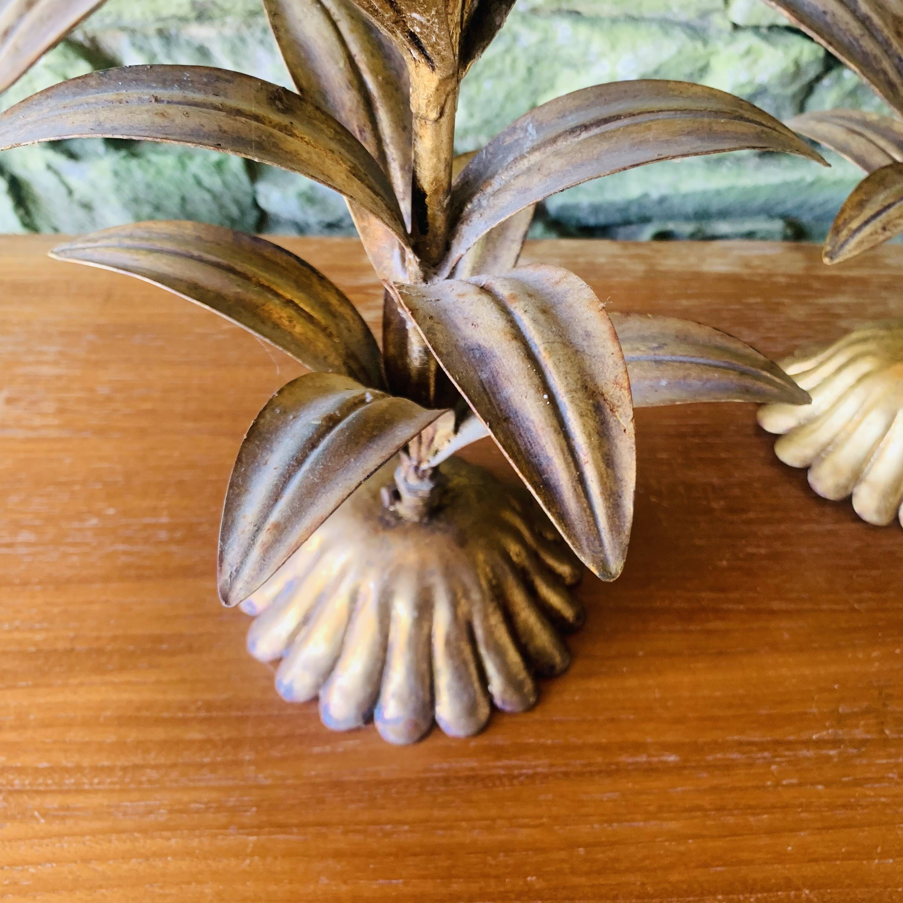 Pair of candlesticks with golden leaves from the 1960s.