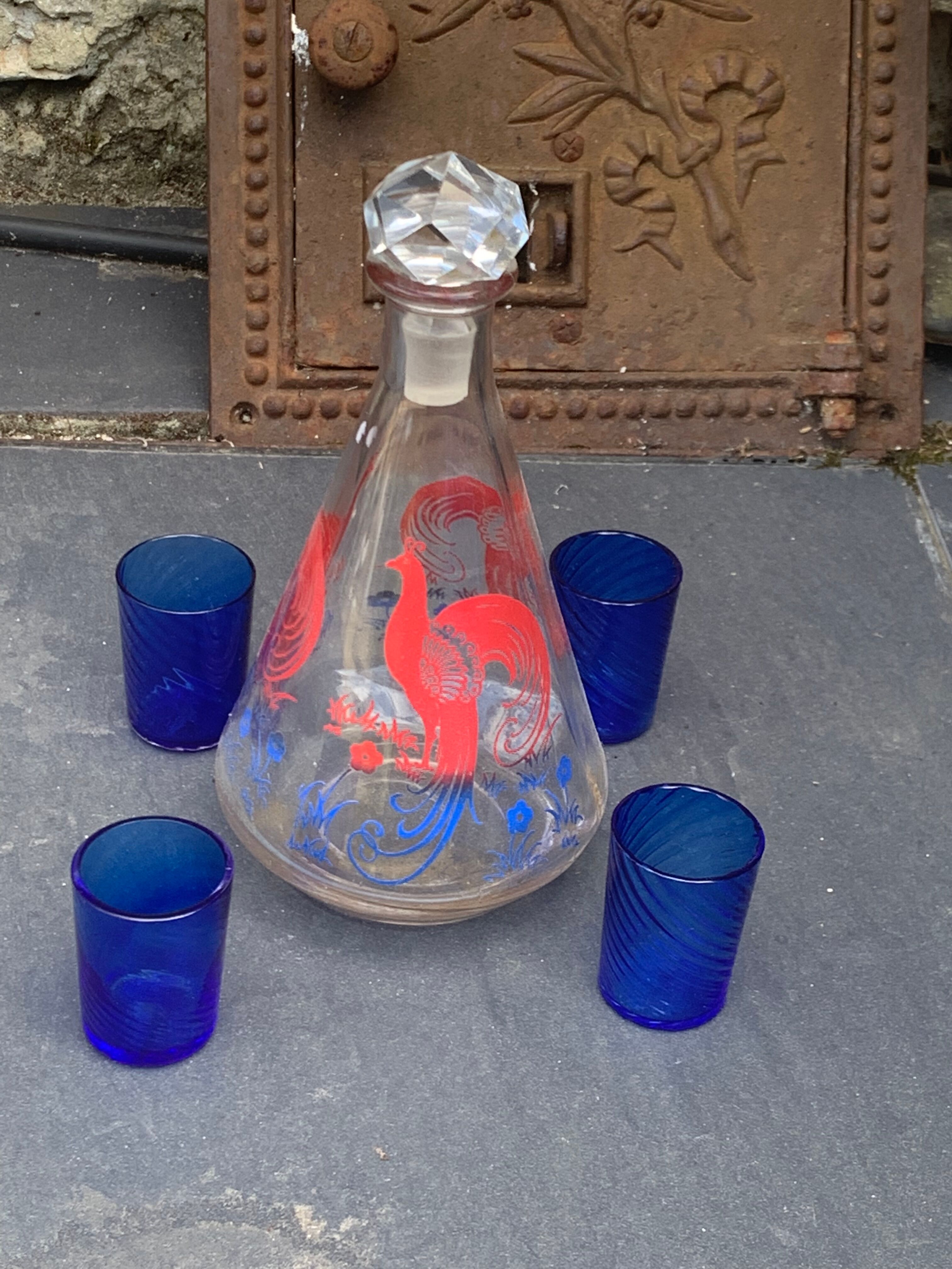 Peacock pattern liqueur decanter and 4 small vintage cobalt blue glasses