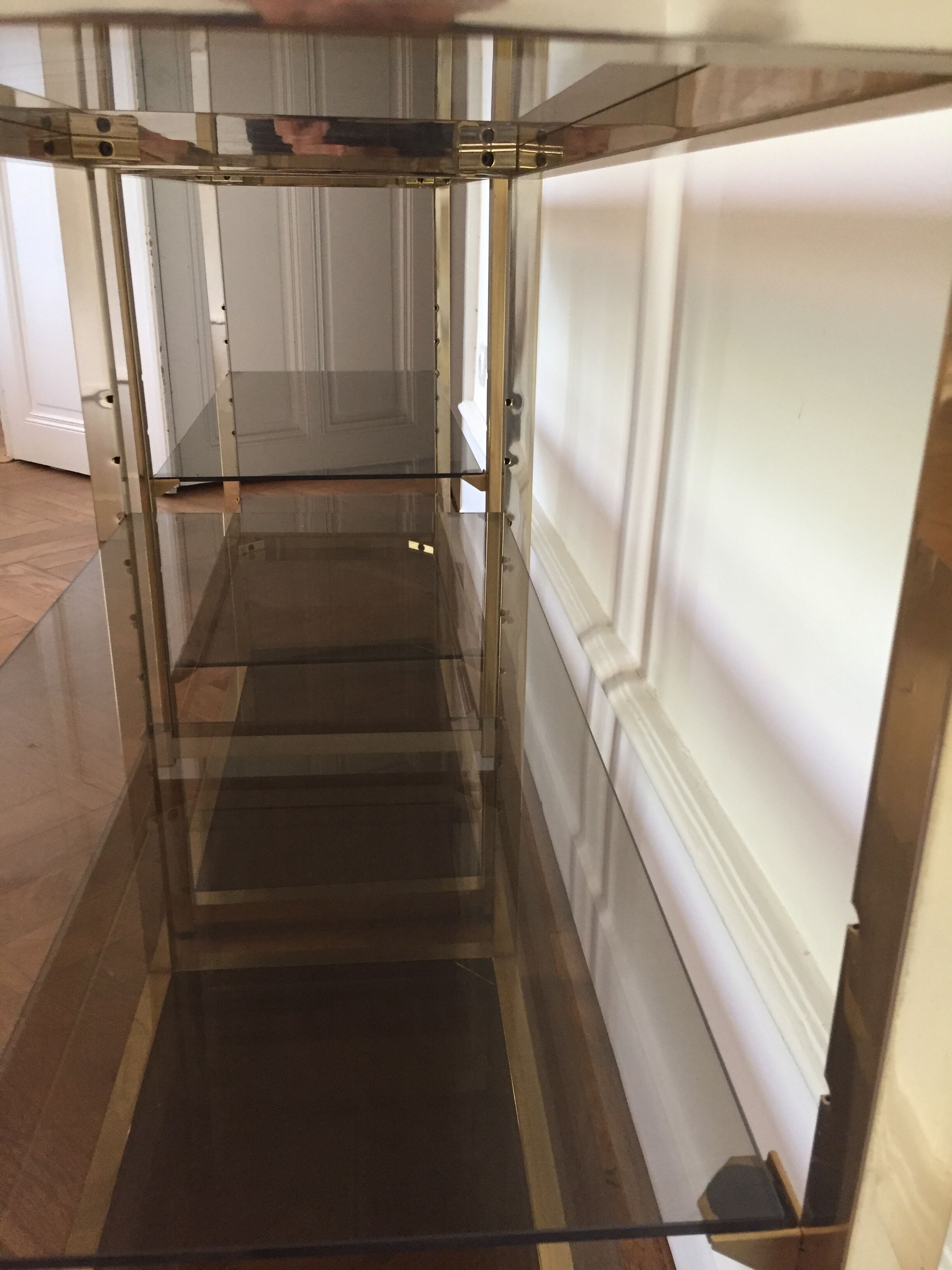 Pair of consoles brass shelves and smoked glass design Roche Bobois