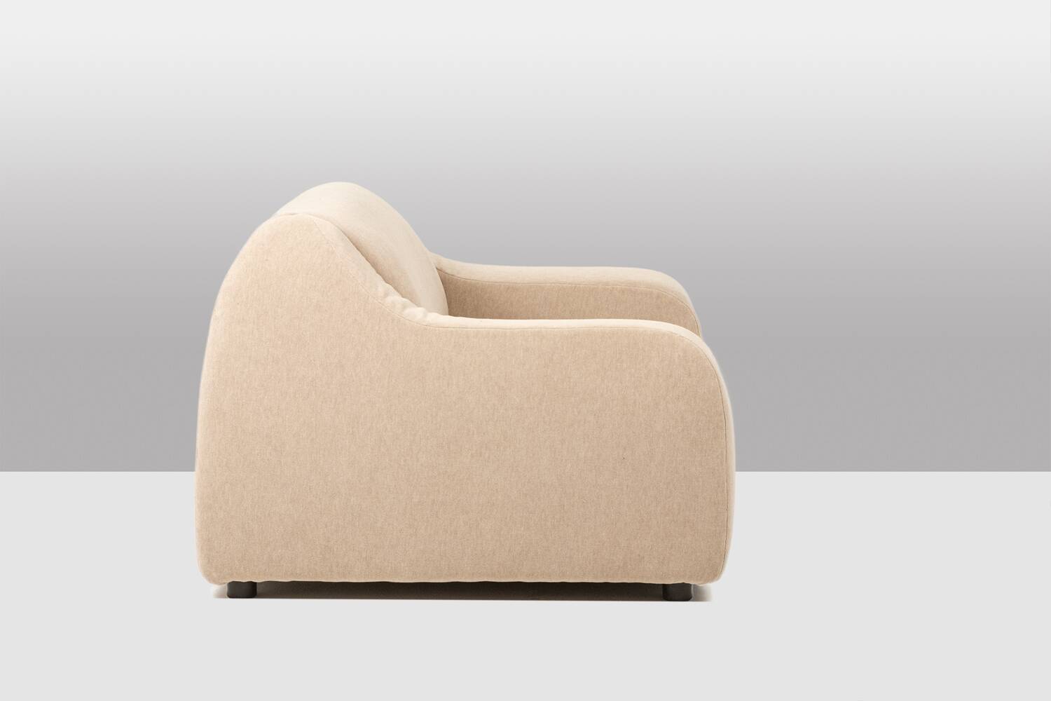 A pair of large and comfortable beige fabric armchairs. Contemporary.
