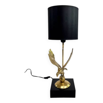 Brass lamp on black lacquered wooden base