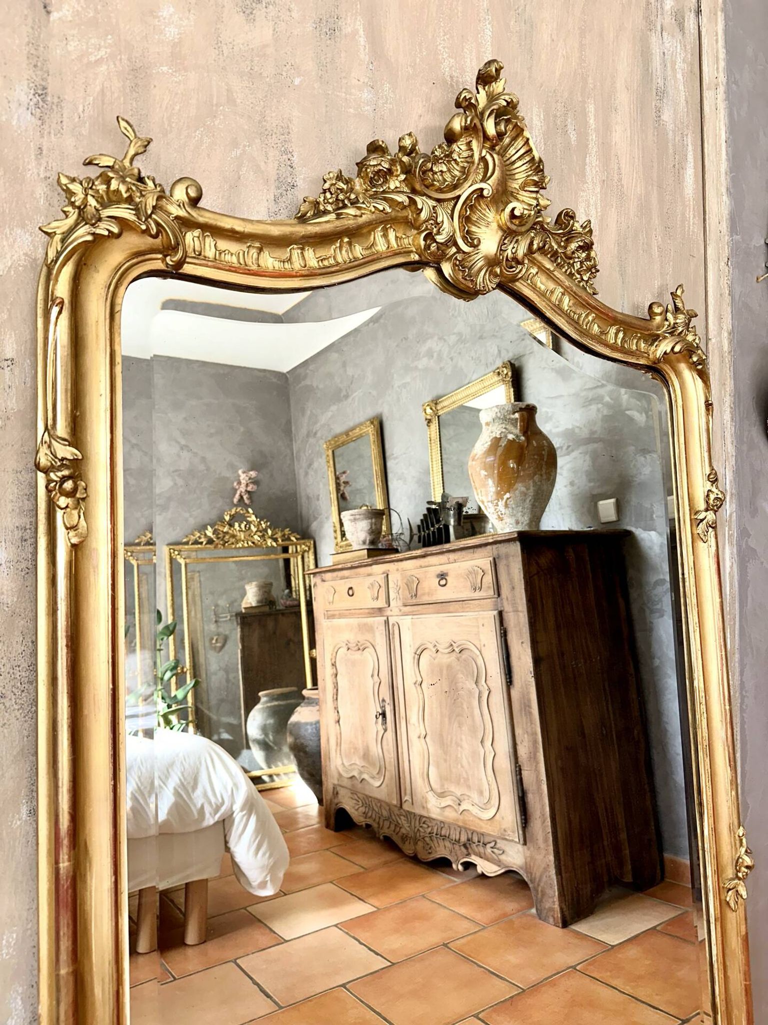 Antique gilded Louis XV pediment mirror