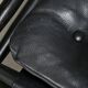 Fauteuil de salon Sirocco Safari Arne Norell en cuir noir et frêne teinté.