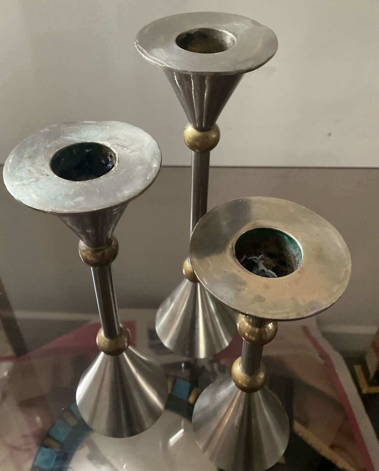 Trio of vintage metal and bronze candle holders