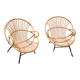 Paire de fauteuils coquille en rotin pieds acier