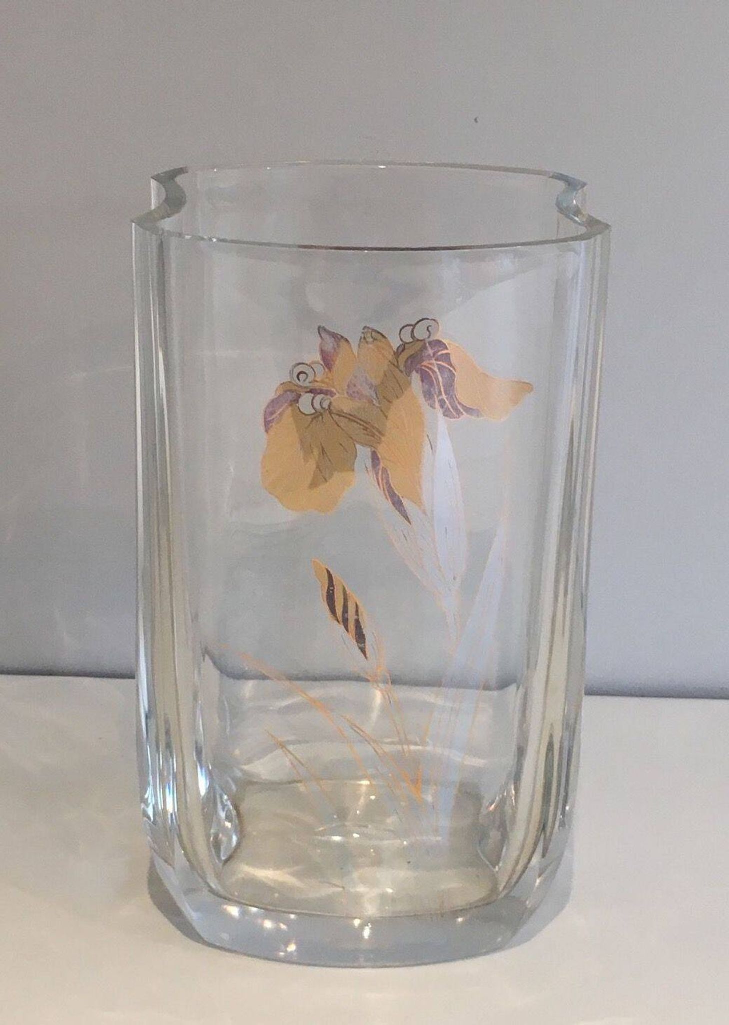 Glass vase with a decoration of a golden flower, around 1970.