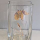 Glass vase with a decoration of a golden flower, around 1970.