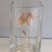Glass vase with a decoration of a golden flower, around 1970.