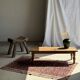 Brown Indonesian teak coffee table, with a border and cylindrical legs H40 L103.