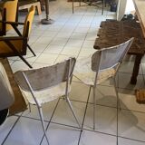 Pair of white metal chairs
