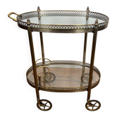Small wheeled table in silvered brass from the Baguès house.
