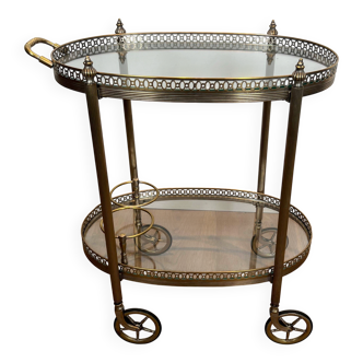 Small wheeled table in silvered brass from the Baguès house.