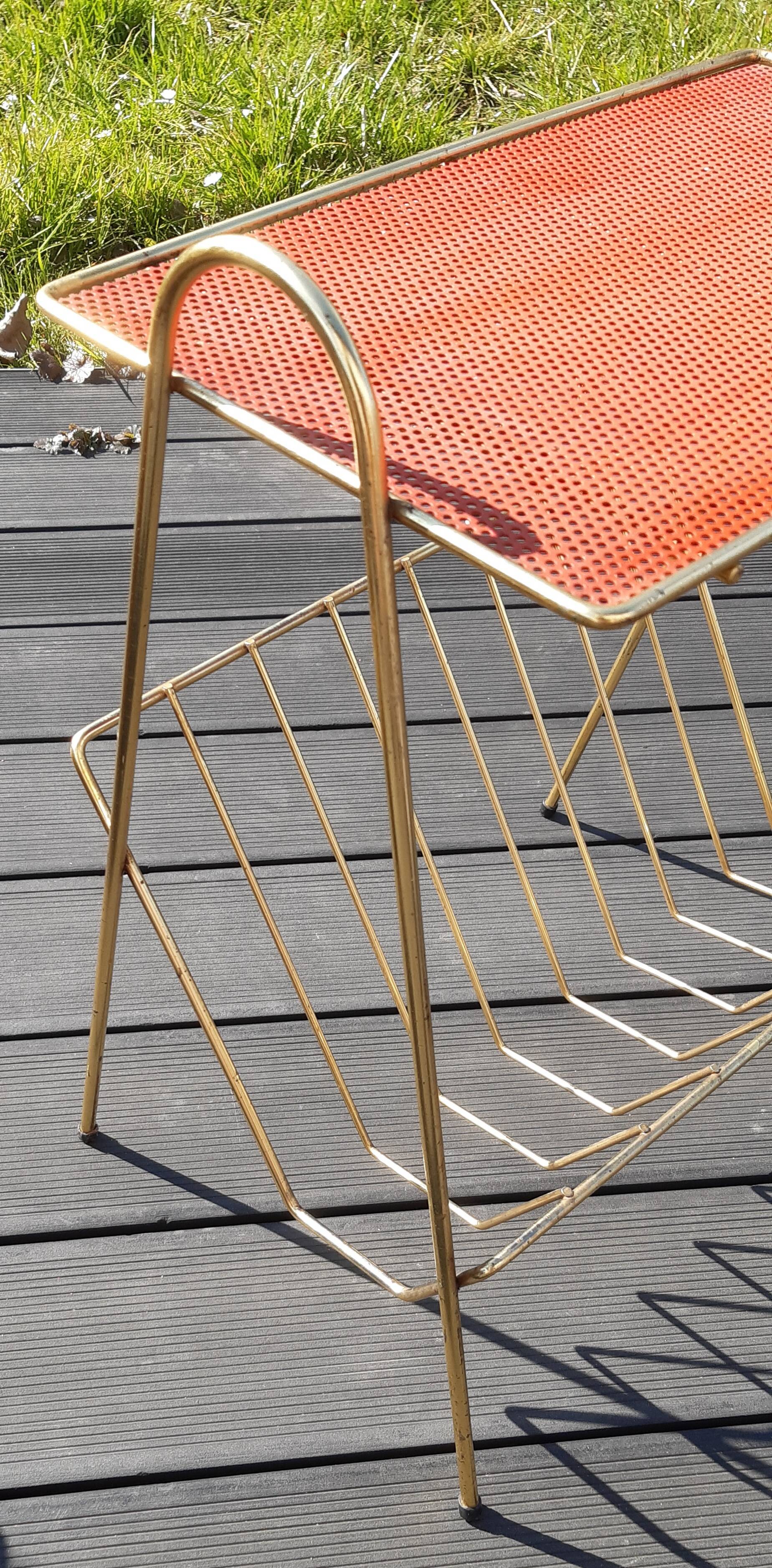 Perforated sheet metal magazine rack in the style of Mathieu Mategot, 1950s
