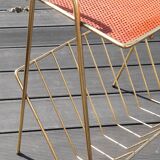 Perforated sheet metal magazine rack in the style of Mathieu Mategot, 1950s