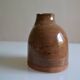 Bottle vase with an off-centre neck in ceramic, signature with a fish to be identified.
