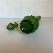 Green carafe bottle with apple, pear, and grape pattern from Italy.