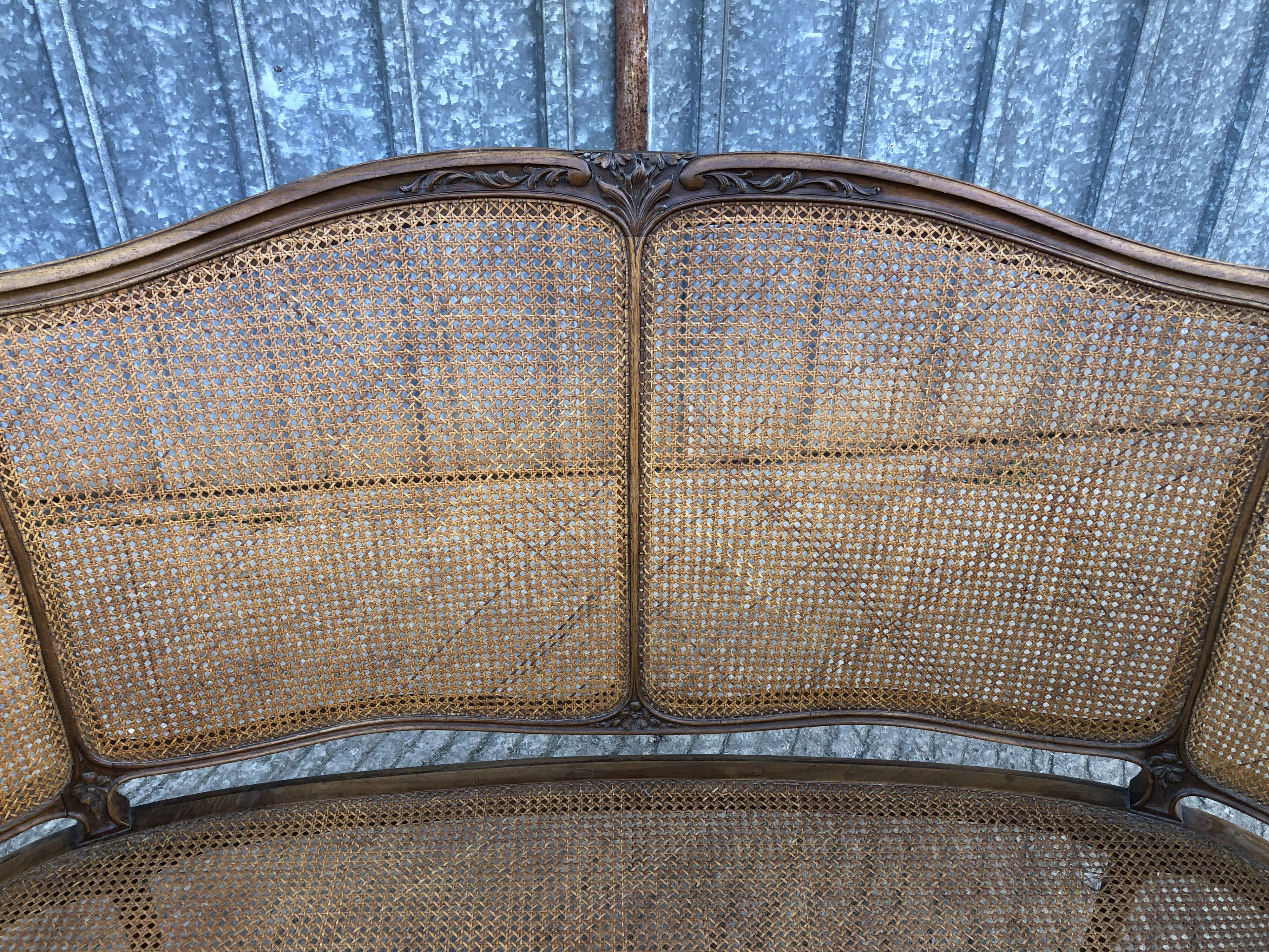Antique Louis XV bench in solid walnut and caning