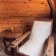 Vintage armchair in solid wood and geometric weaving – lodge spirit