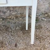 Table/desk with beige patinated square legs and black top