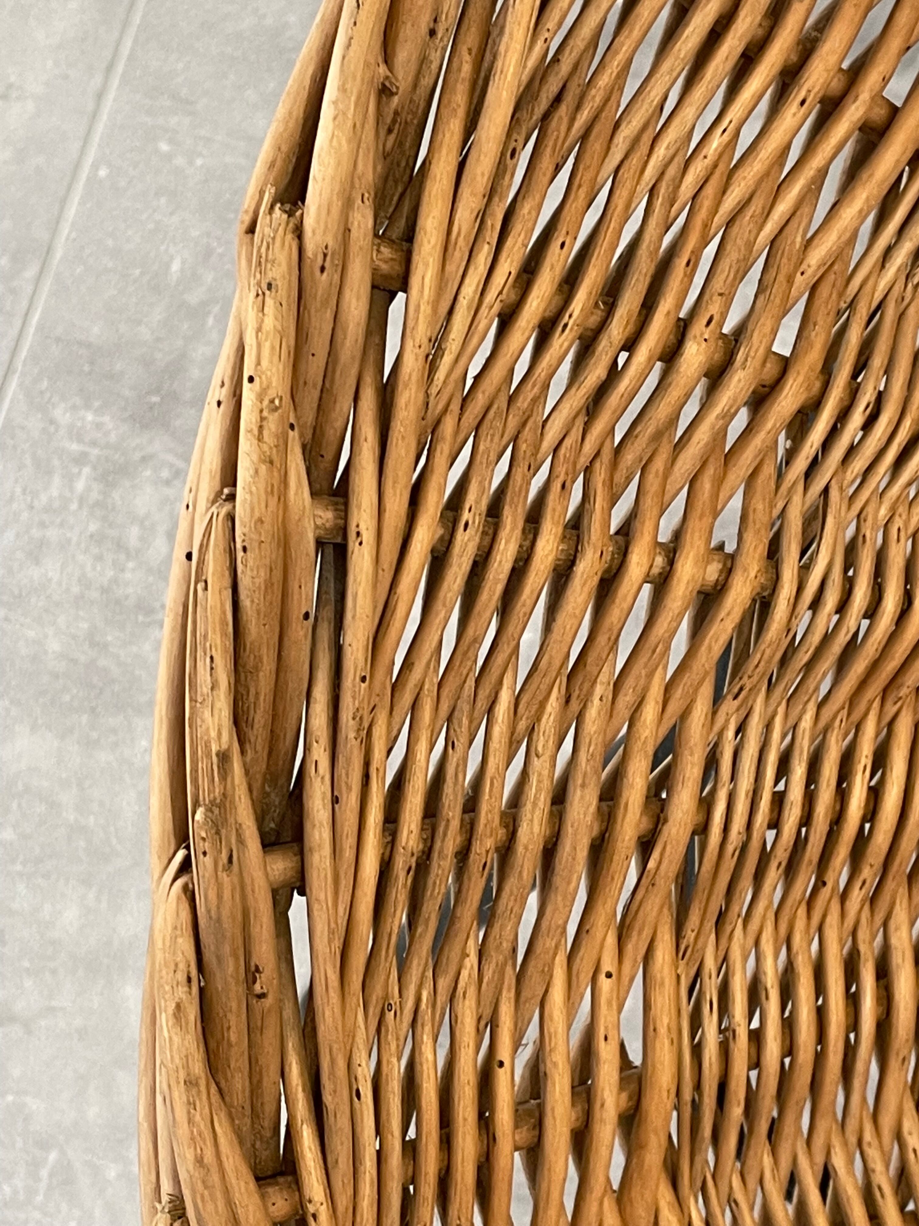 Pair of rattan and black metal armchairs, 1950s/60s