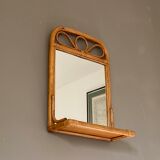Arched rattan mirror with shelf. 1960.