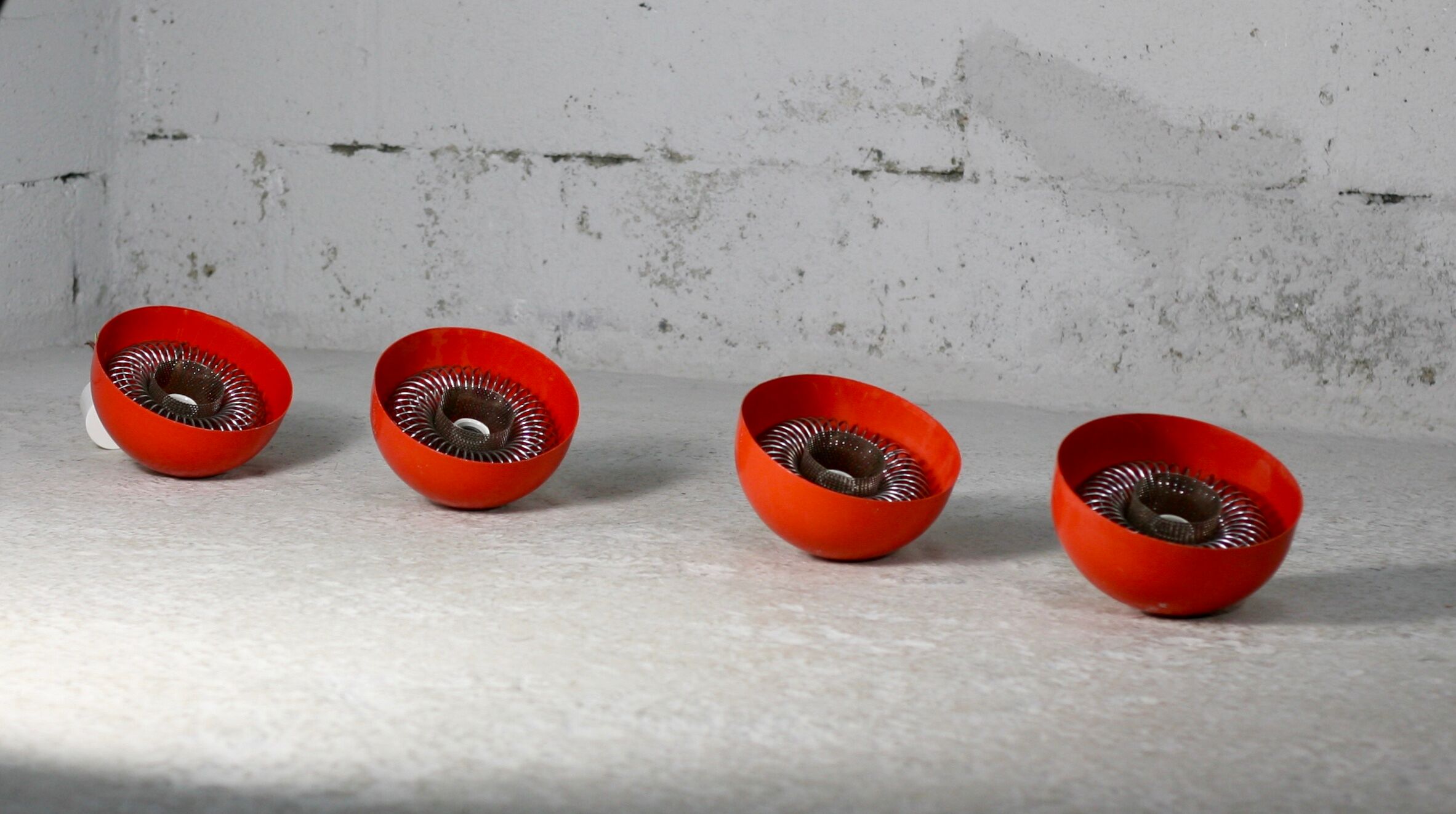 Set of 4 "spring" hanging lamps, orange steel, France, circa 1970