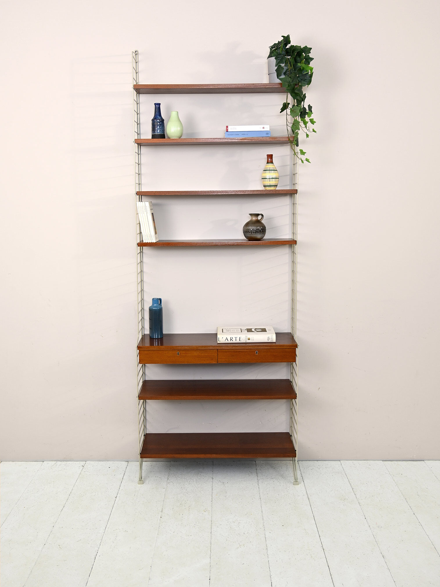 'string' bookcase with metal frame