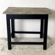 Old blackened wood work table and varnished top