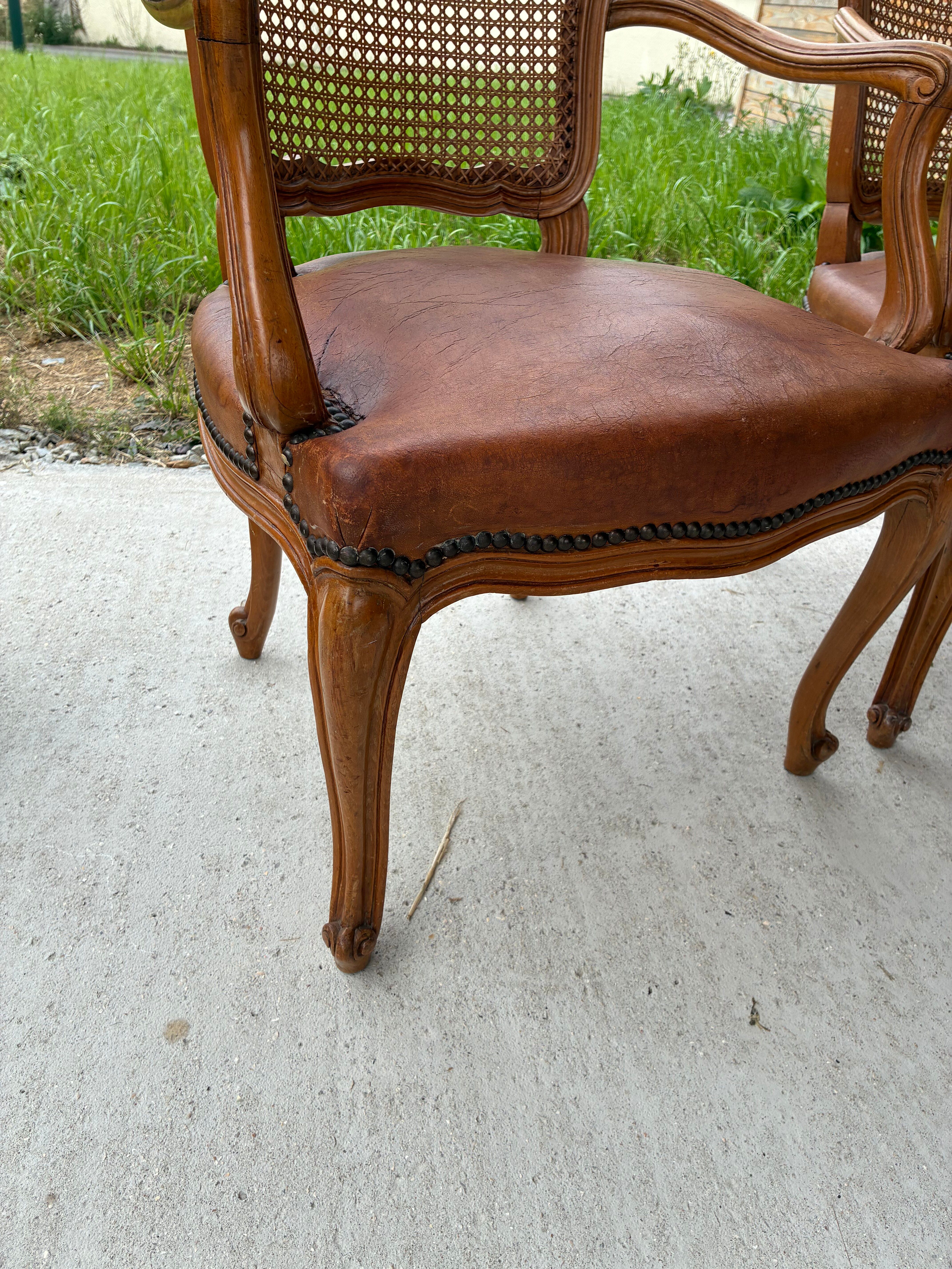 Cane and leather armchair in Louis XV style