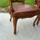 Cane and leather armchair in Louis XV style