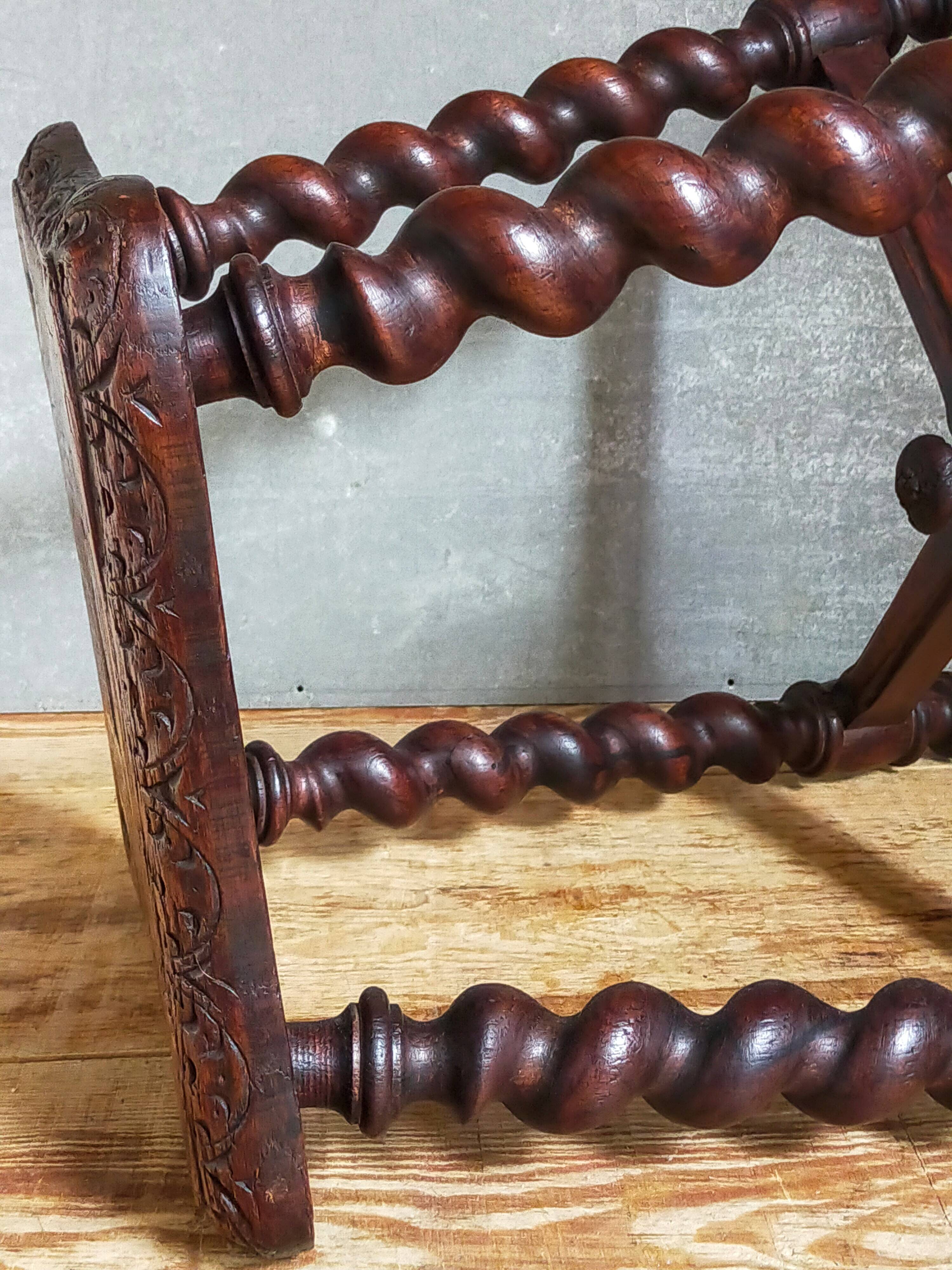 Antique stool in turned and carved solid wood
