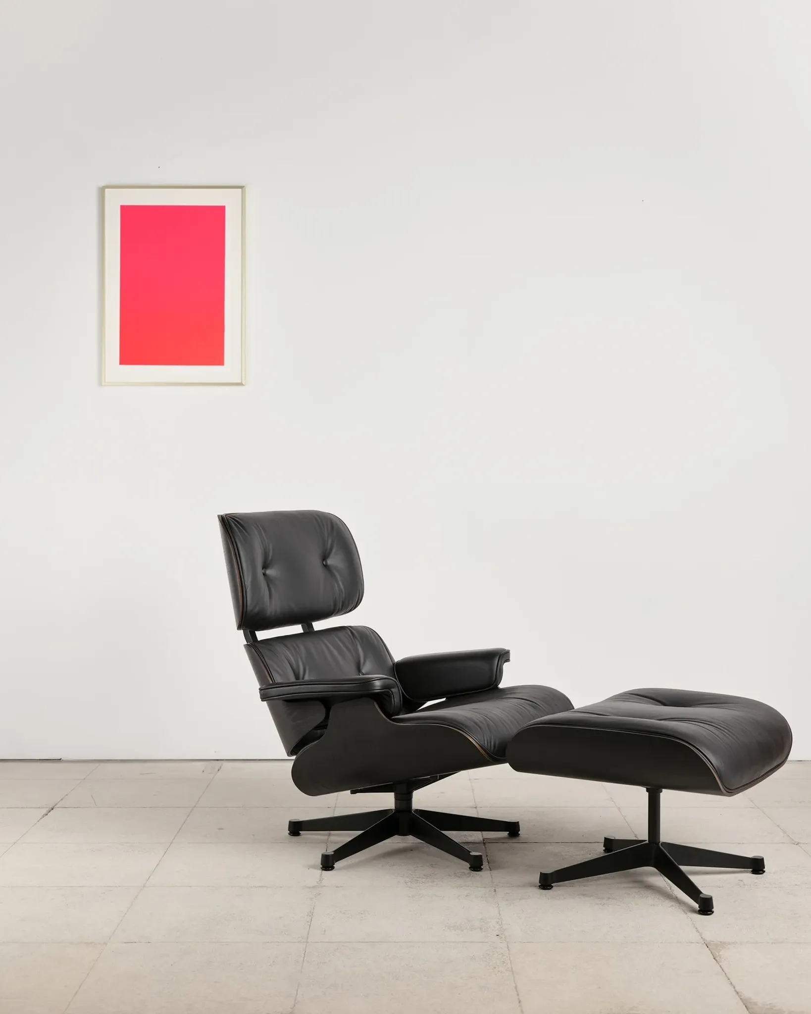Lounge Chair and ottoman in black leather by Charles & Ray Eames, Vitra