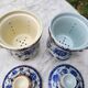 Paire de tasse à thé, couvercle et infuseur